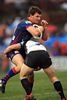 Steve Simpson takes the ball forward.