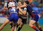 Michael Gordon is collared by a pair of Knights.