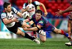 Luke Priddis passes inside ...