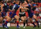 Luke Priddis goes for the gap.
