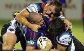 Matthew White is grassed by Penrith defenders.
