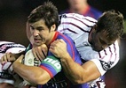 James McManus is taken to turf, in a quiet match for the winger.
