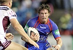 Kurt Gidley puts the moves on Manly.