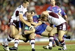It's a Daniel Tolar photo-a-thon as he is tackled by Manly.