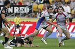 Ryan Shortland about to fend, as Matt Hilder holds on.