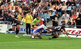 Ryan Shortland crosses, despite Wes Naiqama's best efforts.