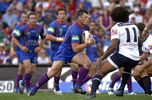 Sam Thaiday is sandwiched by Daniel Tolar (in match number 50!) and Danny Buderus.