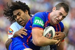 Sam Thaiday fends off Wes Naiqama and looks to offload.