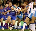 Danny Wicks charges the ball forward.
