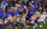 Very small photo of Chris Bailey putting on a big fend.