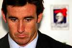 Andrew Johns looks down ...